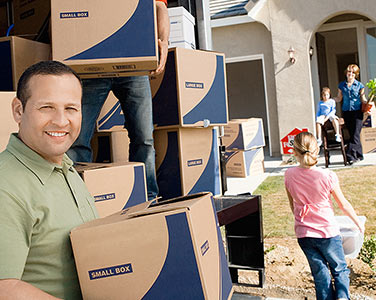 A happy family moving into their new home.